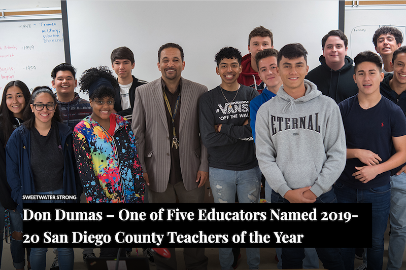 Don Dumas with a group of students
