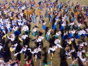 Group of students dancing on the football field