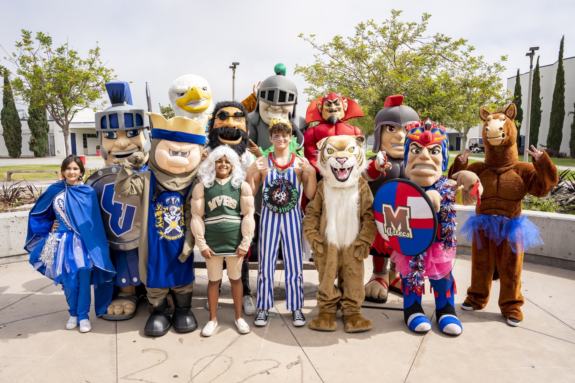 Group photo of school mascots with a title "WHERE YOU BELONG!" #WeAreSUHSD 