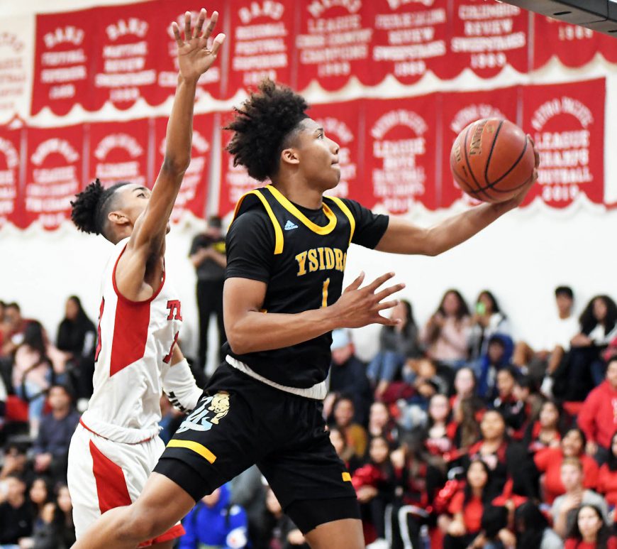 San Ysidro freshman Mikey Williams flies toward the basket in Wednesday’s South Bay League game at Castle Park. Photo by Phillip Brents (Star News)